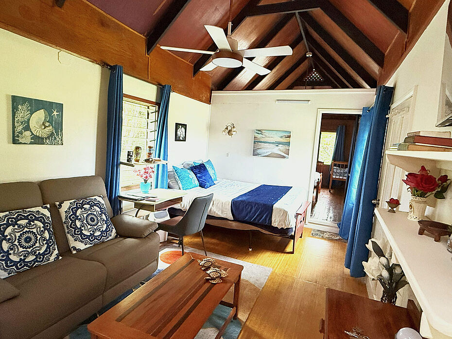 Dining area opens to the living-room with second queen bed and private bedroom with queen bed