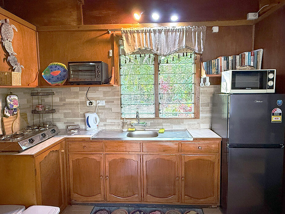 Fully self-contained with variety of kitchen and cookware, toaster oven, microwave oven, hot water kettle, 2 burner gas stove, full size refrigerator-freezer with ice waiting for you
